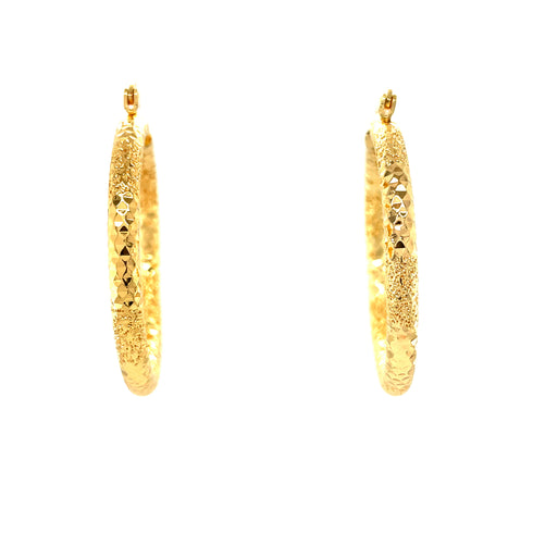 The Beautiful Texturized Hoops Earrings, crafted from 14k gold-filled material and measuring 4cm in diameter, are elegantly displayed against a pristine white background. These exquisite hoop earrings are lead and nickel free, offering both style and comfort for all-day wear.