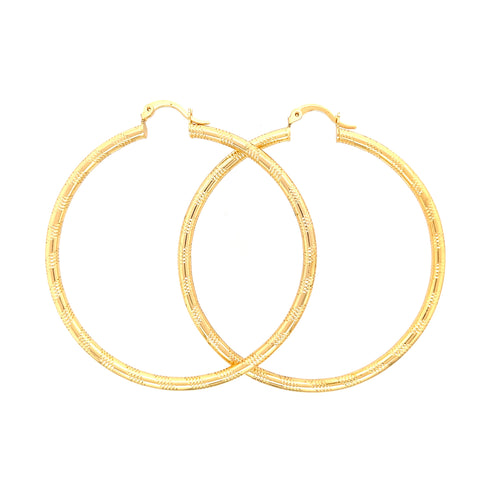Against a plain white backdrop, the Huge 6 cm Wire Textured Hoops earrings, crafted from 14k gold filled material, exhibit a refined elegance. These stylish earrings are lead and nickel free, promising both comfort and sophistication.