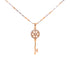 The Beautiful Iced Key Pendant Necklace boasts a luxurious two-tone 14k rose-silver and gold-filled finish, featuring a striking pendant encrusted with sparkling diamonds. Its elegance is further enhanced by the Valentin Mariner chain, while the key's ornate circular design adds an extra touch of sophistication.