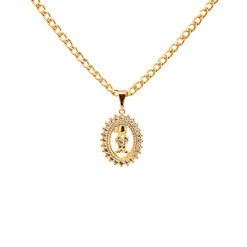 A 14k gold-filled Cuban link necklace with a detailed oval pendant on a white background. The Little Boy Pendant Necklace features a central figure framed with small clear stones arranged in a decorative pattern, making it an ideal Mother's Day gift.