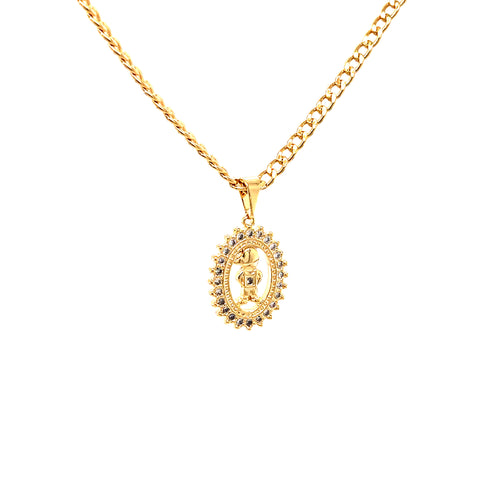 The Little Boy Pendant Necklace, an exquisite Mother's Day gift, showcases a 14k gold-filled pendant with intricate detailing, surrounded by small gemstones. This elegant piece gracefully hangs on a delicate Cuban link chain against a white background, highlighting its timeless beauty.