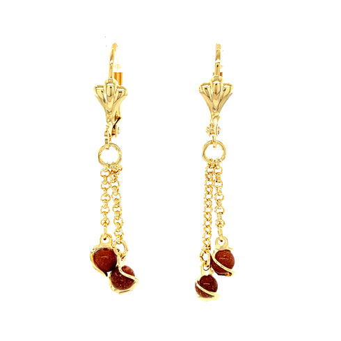 The Goldstone Aventurine Dangle Earrings, crafted with 14k gold-filled accents, boast elegant lever-back closures with delicate chain links adorned with small brown beads. This sophisticated design features aventurine gemstones, making it a perfect choice for adding a touch of elegance.