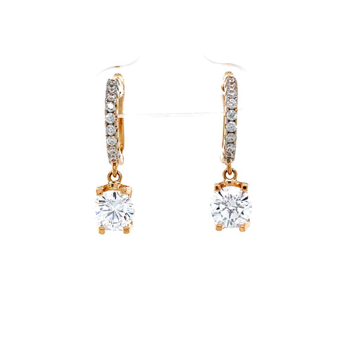 The Beautiful Drop Zirconia Stone Huggie Earrings in rose gold-filled design feature a row of small diamonds on the hoops, each adorned with a large, sparkling round-cut zirconia dangle. These stunning accessories are safe for any skin type and add a touch of elegance to any outfit.