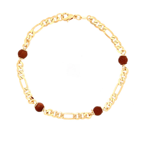 The Aventurine Goldstone in a Figaro Chain Link Bracelet features vibrant red beads elegantly spaced along its 14k gold-filled chain. This stunning bracelet is secured with a lobster clasp closure, combining timeless style with modern elegance.