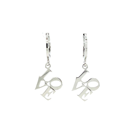 The Love word Huggie drop earrings in white Gold filled feature the word "LOVE" as a charm on each. Inspired by block letters, these earrings maintain a minimalist and elegant look against a plain white background.