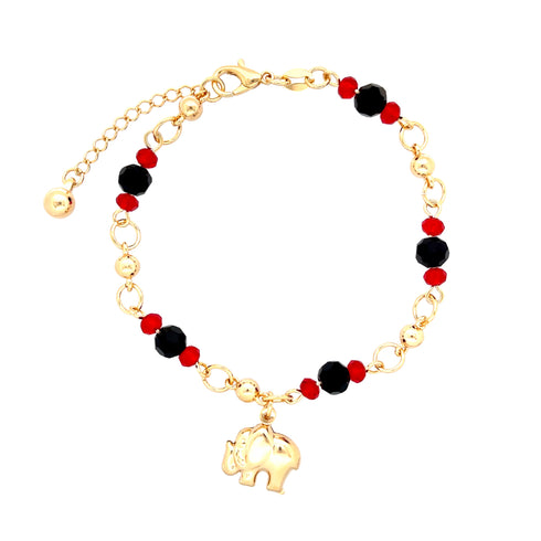 The Elephant Charm Bracelet with Black and Red Beads is a beautiful accessory crafted from 14k gold-filled material. It showcases a gold chain embellished with black and red beads, along with a delicate elephant charm. The adjustable chain guarantees an ideal fit for any wrist size.