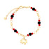 The Elephant Charm Bracelet with Black and Red Beads is a beautiful accessory crafted from 14k gold-filled material. It showcases a gold chain embellished with black and red beads, along with a delicate elephant charm. The adjustable chain guarantees an ideal fit for any wrist size.