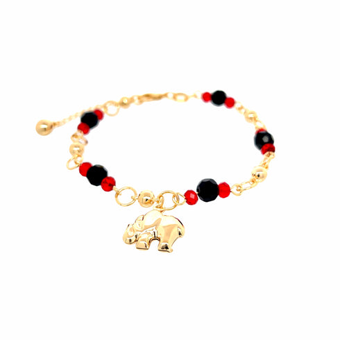 The Elephant Charm Bracelet with Black and Red Beads is a stunning 14k gold-filled accessory featuring an elegant combination of black and red beads. Its adjustable chain ensures a perfect fit while highlighting its enchanting elephant charm centerpiece.