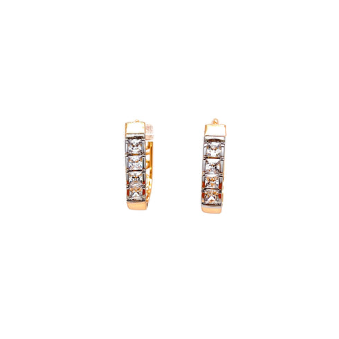 The Huggies Earrings, beautifully crafted in rose gold-filled metal, feature four square-cut cubic zirconia stones arranged in a vertical line along the front against a plain white background.