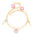 The Evil Eye Keys and Hearts Charms bracelet figaro link chain is a 14k gold-filled piece featuring a heart charm and two key charms. This bracelet, adorned with pink heart accents and small eye details, offers spiritual protection to its wearer.