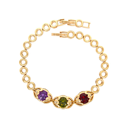 Introducing the Red Green and Purple Gemstone Link Bracelet, elegantly crafted with circular links and adorned with vibrant gemstones. Each stunning stone is set in decorative 18k gold-filled metal, ensuring it's both lead-free and nickel-free for your comfort.