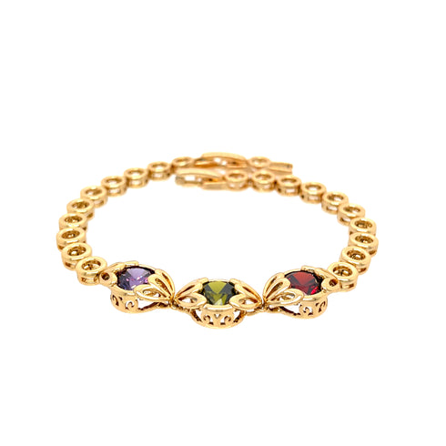 The Red Green and Purple Gemstone Link bracelet, crafted in 18k gold-filled material, features a beautiful circular link design adorned with three large gemstones in striking purple, green, and red shades. Each gemstone is set in decorative settings, ensuring the bracelet remains lead and nickel-free for comfortable wear.
