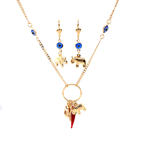The Mega Lucky Charm Pendant Necklace and Earrings set, crafted with 14k gold-filled Cuban link chain, provides protection and luck with its blue evil eye beads. The necklace showcases elephant charms alongside a red lucky charm pendant, while the dangling earrings feature the same captivating design with matching beads and elephant accents.
