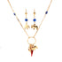 The Mega Lucky Charm Pendant Necklace and Earrings set, crafted with 14k gold-filled Cuban link chain, provides protection and luck with its blue evil eye beads. The necklace showcases elephant charms alongside a red lucky charm pendant, while the dangling earrings feature the same captivating design with matching beads and elephant accents.