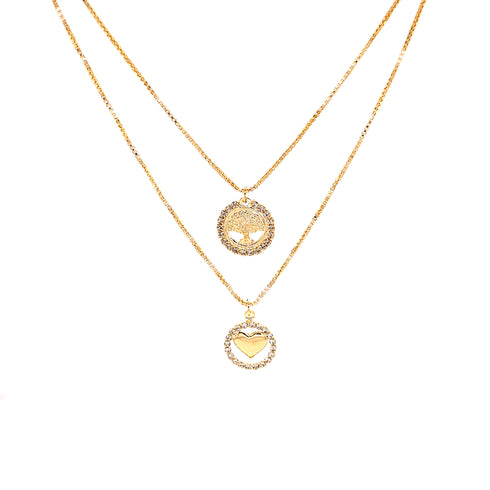 A pair of layered necklaces made from 14K gold-filled material is displayed against a white backdrop. The upper necklace showcases a delicate circle pendant with intricate patterns, while the lower piece highlights a larger circular pendant embellished with zirconia stones and featuring a central heart design, exuding elegance and charm. Named the "Heart and Tree of Life Zirconia Stones Pendant Necklace," these pieces are connected by a sophisticated box link chain.