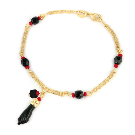 Genuine Jet Black Azabache Bracelet featuring a gold chain with red and black beads and a black foot-shaped charm, crafted with 14k gold filled azabache jewelry for spiritual protection.
