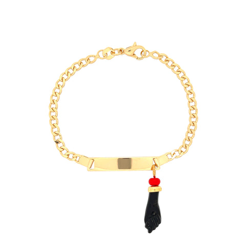 The Black Figa Hand Charm Baby Bracelet combines spiritual protection with style, showcasing a rectangular plain plate on a 14k gold-filled Cuban curb chain link. The standout feature is the striking black figa hand charm paired with a vibrant red bead.