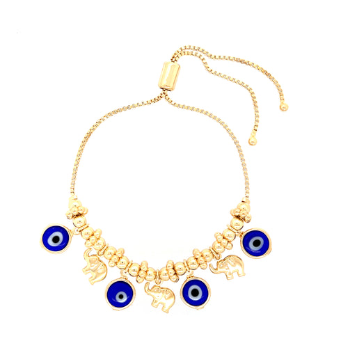 The Blue Evil Eyes Tiny Elephant Charm Bracelet features a 14k gold-filled chain with alternating gold beads and elephant charms, beautifully highlighted by blue evil eye charms. Its adjustable design ensures it fits any wrist perfectly.