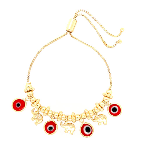 The Red Evil Eyes Tiny Elephant Charm bracelet, made with 14k gold filling and featuring an adjustable sliding clasp, showcases an elegant design with an elephant charm alongside red circular charms accented by black and white centers, making it the perfect choice for those in search of a sophisticated evil eye bracelet.