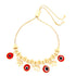 The Red Evil Eyes Tiny Elephant Charm bracelet, made with 14k gold filling and featuring an adjustable sliding clasp, showcases an elegant design with an elephant charm alongside red circular charms accented by black and white centers, making it the perfect choice for those in search of a sophisticated evil eye bracelet.
